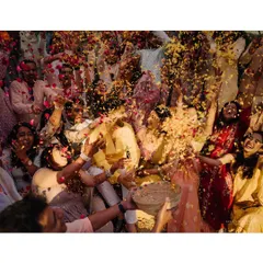 A shower of love and petals. This is the beautiful chaos of a haldi ceremony, a moment of pure euphoria that I love to capture. The air is filled with marigold petals, laughter, and celebration.