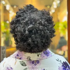 Embracing the beauty of a TWA (Teeny Weeny Afro). This big chop reveals the gorgeous texture of coily hair and is a healthy, stylish way to start a natural hair journey.
