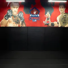 Our training area, with heavy bags ready for work and murals of MMA legends to inspire you. This is where you will learn to strike with power and precision.