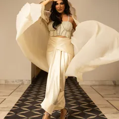 The graceful Chitrangda Singh embodies modern royalty in the ivory Alauren Set, featuring a flowing cape and a beautifully draped skirt.