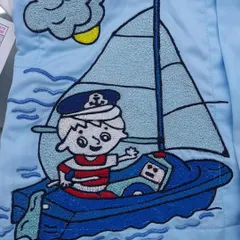 Another detail from the boat-themed saya kurta, showing a little sailor. I can create custom embroidery based on any theme for your child's outfit.