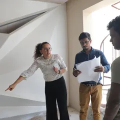 Our principal architect on-site, discussing plans with the construction team. This is where design meets execution, ensuring every detail of the blueprint is brought to life with precision.