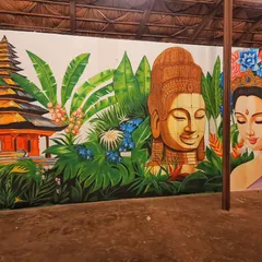 A closer look at the left side of our Bali mural, highlighting a traditional temple surrounded by vibrant green banana leaves and tropical flowers.