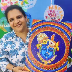 A participant at the ArtBox Studio proudly displays her magnificent dot painting of Krishna on canvas. The intricate details and vibrant colours show the beautiful results of rediscovering a passion for art after many years.