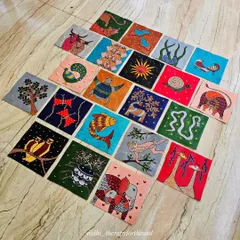 An angled view of the 20 Gond art paintings, showing how they look together as a collection before being shipped to the client.