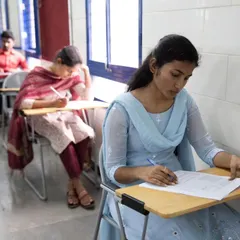 Students taking their written language proficiency exams. We conduct formal assessments to certify their skills in reading, writing, listening, and speaking.