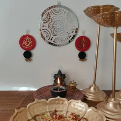 A pair of my handmade Ganpati wall hangings in red and black, perfect for adding a divine touch to your home decor during festivals.