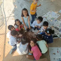 We believe in learning through doing. Children get their hands dirty, mixing soil and crushed eggshells to enrich the earth for planting, a wonderful sensory activity that teaches them about nature's cycles.