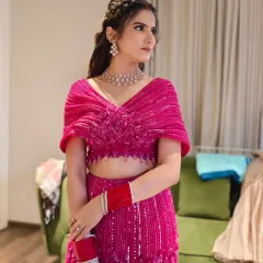 For a vibrant sangeet or reception, a full glam look can be magical. Here, I paired a shimmering pink eye with a glowing base and a modern hairstyle to match the energy of the celebration.