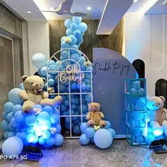 Here is a classic "It's a Boy" baby shower setup with a popular teddy bear theme. I combined a full balloon arrangement with custom props like the window arch, light-up 'BABY' blocks, and an 'Oh Baby' neon sign to create a fun and memorable corner.