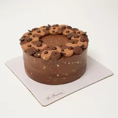 My bestselling Belgian Chocolate Mousse Cake, ready for a celebration. It's made with layers of moist chocolate sponge, chocolate chips, and a melt-in-your-mouth mousse.
