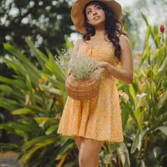 A bright, cheerful shot showcasing a summer dress in a garden setting. This highlights my ability to create vibrant lifestyle images for casual wear brands.