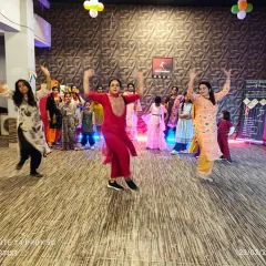 A moment of pure joy and energy from one of our ladies' workshops. This picture captures the fun of learning a new Bollywood routine together in a group setting.