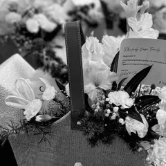 A black and white view of the bulk gifting baskets, emphasizing the texture and form of the arrangement.
