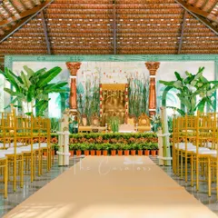 A full view of our reimagined Muhurtham stage, set within a traditional hall. We used lush greenery and a custom backdrop to create a focal point that is both elegant and unique.