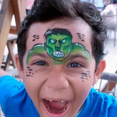 The reaction is everything. This full-face Hulk transformation brought so much excitement. I love creating superhero looks that make kids feel powerful and ready for adventure at their birthday parties.