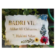 The resin nameplate photographed outdoors, showing how the colors and details look in natural light.