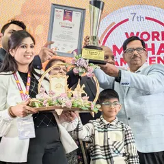 Another proud moment from the awards ceremony. Here I am with my team, holding the trophy and a certificate of excellence, celebrating this incredible achievement.