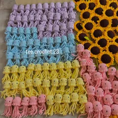 Rows of my pastel amigurumi jellyfish, a popular item for shop decor. This photo shows the consistent quality and cute design you can expect in a bulk order of my crochet characters.