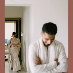 A stolen glance. While he wasn't looking, we captured her smiling at him from across the hallway. These are the quiet, in-between moments that tell the real story.