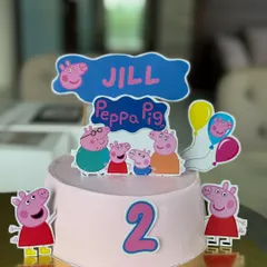 A sweet Peppa Pig theme cake for a 2nd birthday celebration. All characters and decorations are created with edible toppers on a smooth, creamy frosting base, making it completely kid-friendly and delicious.
