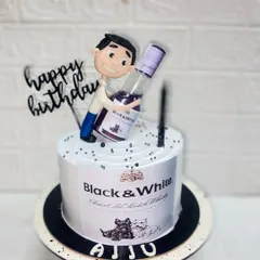 For the birthday boy and his favourite drink. This pineapple cake is designed to look like a Black & White whisky bottle, complete with a custom caricature.