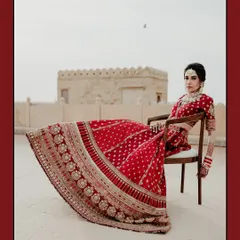 A bride reigning over her kingdom. This powerful portrait of Sonakshi at Suryagarh, Jaisalmer, uses the stark, beautiful landscape to create a sense of modern royalty.