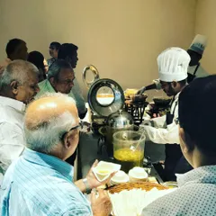 Guests love to watch their food being made. A bustling live counter like this one adds a dynamic and engaging element to any gathering, ensuring your event is memorable.