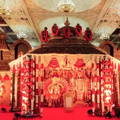We specialize in creating breathtaking, temple-style mandaps that honor tradition. This expansive setup features intricate carvings and layers of floral garlands, creating a divine atmosphere for the sacred wedding rituals.