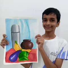 Ishan, a 9th standard student, with his object drawing done in watercolor. This still life composition shows his skill in painting realistic textures and reflections on different surfaces.