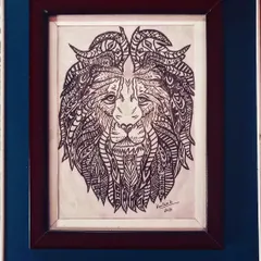 The face of a lion, created with dozens of different zentangle patterns to form its majestic mane.