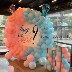 A classic "Boy or Girl?" gender reveal decoration. I used a circular backdrop with a balloon arch split between pink and blue to build excitement for the big reveal.