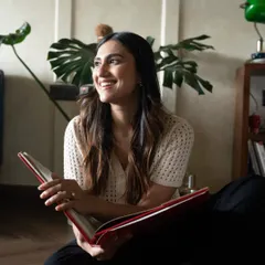 A candid shot of Rhea enjoying a book in her space. Lifestyle images like this help build a connection by showing the person behind the profession.