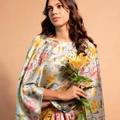 A lovely portrait shot where the makeup enhances the model's natural beauty. The soft, fresh glam includes a neutral eye, rosy cheeks, and a natural lip color, perfect for a daytime engagement or brunch.