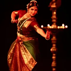 Performing at the India Habitat Centre for 'Soukariyam - The Aesthetic'. The traditional lamp, or 'diya', is an integral part of the stage setting, symbolizing the light of knowledge and art.