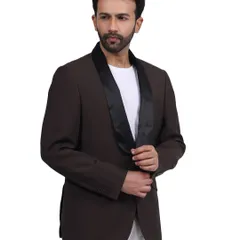 A model wears a brown blazer with a satin lapel, creating a sophisticated evening look. This image is perfect for a brand's lookbook or a campaign focused on special occasion wear.