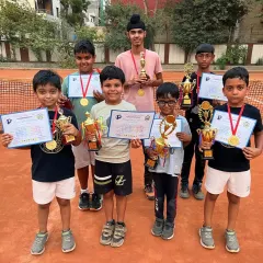 A group of our champions with their medals, certificates, and trophies. The camaraderie and shared success are an important part of the tournament experience we create.