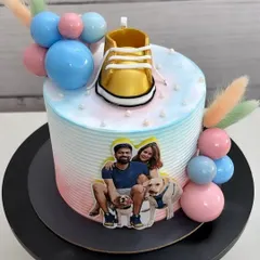 Welcoming a little one with a bumper treat. This Nutella mousse cake features a photo of the parents-to-be and their furry friends.