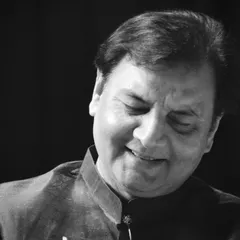 A black and white portrait capturing a moment of quiet satisfaction during a performance.