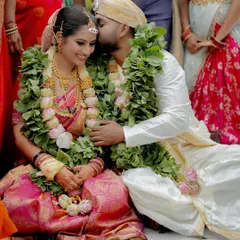 A sweet kiss of blessing during the ceremony. These are the heartfelt moments of affection that I cherish capturing, showing the love that surrounds you on your special day.