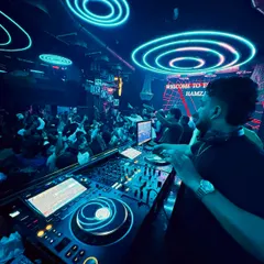In the zone, surrounded by neon lights and the energy of the crowd. This is where I feel most at home, mixing live and reading the room to play the perfect track at the perfect moment.