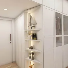 This is a 3D design I created for a client's daughter's bedroom in Goregaon. It shows a floor-to-ceiling white wardrobe with integrated corner shelves for display items, maximizing storage and style.