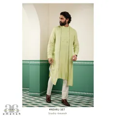 The light green drape kurta shown on its own, highlighting its asymmetric hem and subtle detailing before layering.