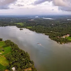 Another perspective of the green backwaters near Udupi. The drone reveals the intricate network of water channels and the vibrant landscape of the coastal region.