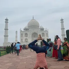 Another headstand variation in front of the Taj Mahal. This one with bent knees challenges the balance in a different way.