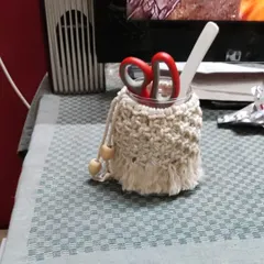 A student's work, this macrame utility jar is being used as a stationery holder. It's a perfect example of how you can create functional art for your home.
