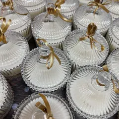 A closer look at the detailed craftsmanship of our crystal jar wedding candles. These are perfect for adding a touch of luxury to your guest tables or as part of a welcome hamper.