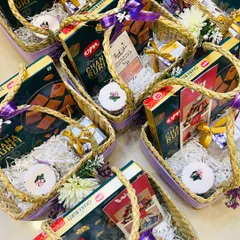 Say 'thank you' in style with these beautifully curated return gift hampers. Each basket is filled with traditional Indian sweets and decorated with a purple ribbon.