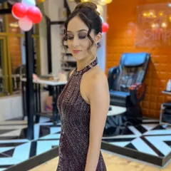 Her smile says it all. This client is glowing with our flawless makeup and elegant updo, ready for her special event.