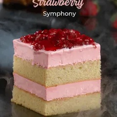 This is my Strawberry Symphony pastry, a perfect harmony of light sponge cake and fresh strawberry cream. It's topped with a sweet strawberry compote, offering a burst of fruity flavour in every bite.